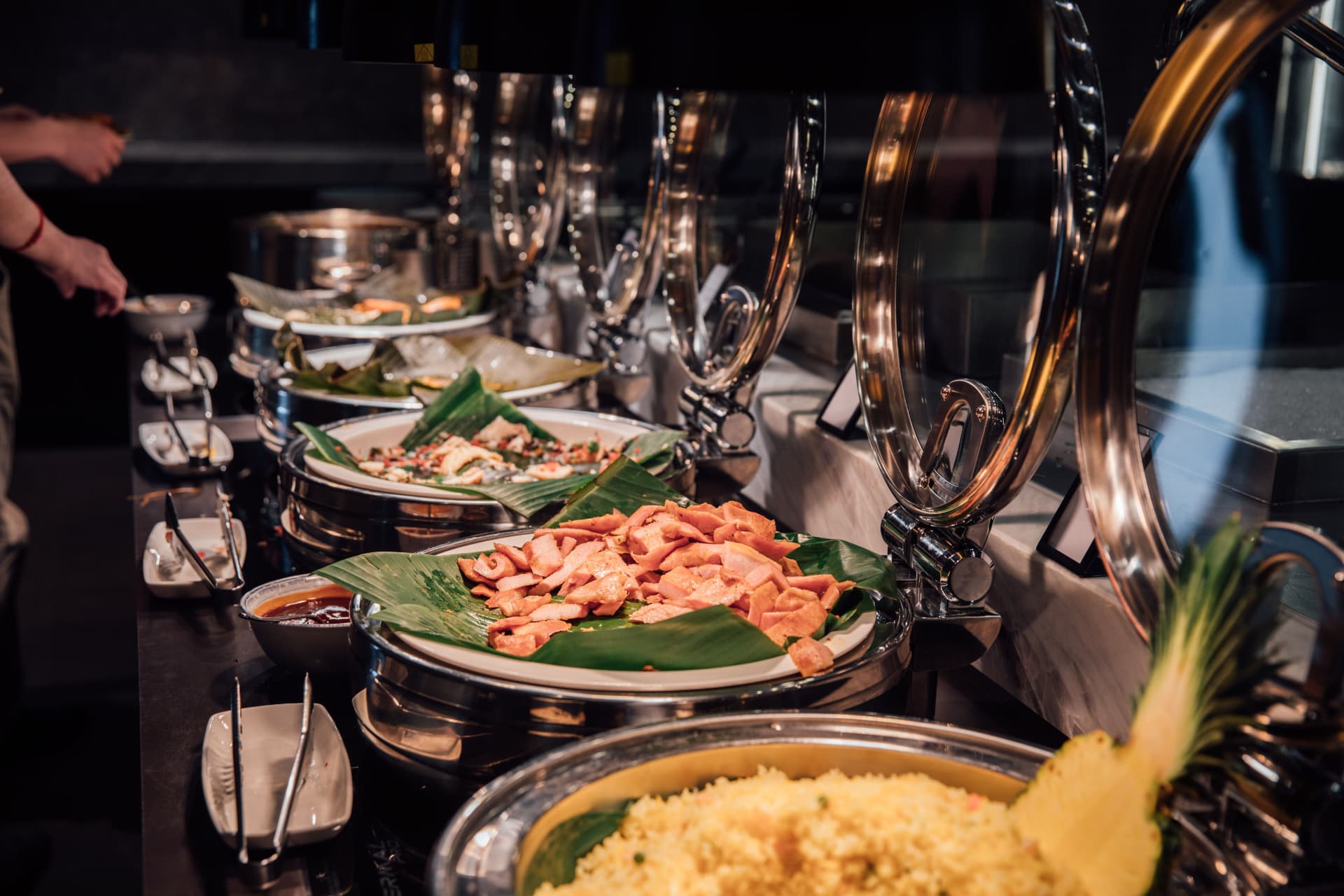 Chafing dishes on a professionally set corporate buffet line