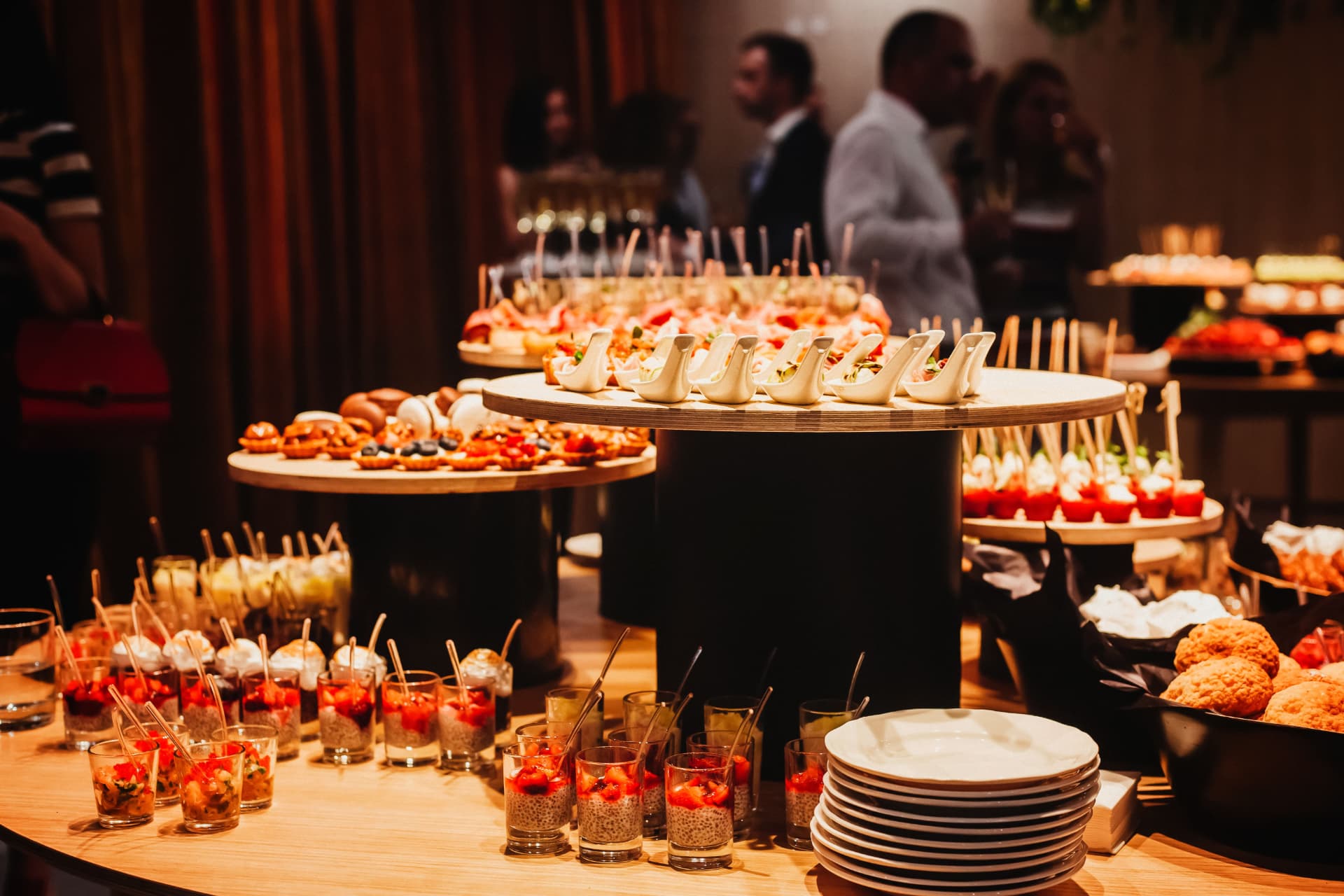 Canapé and dessert tables set up at a corporate function